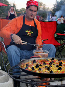 Chef Eric Paz cooking paella